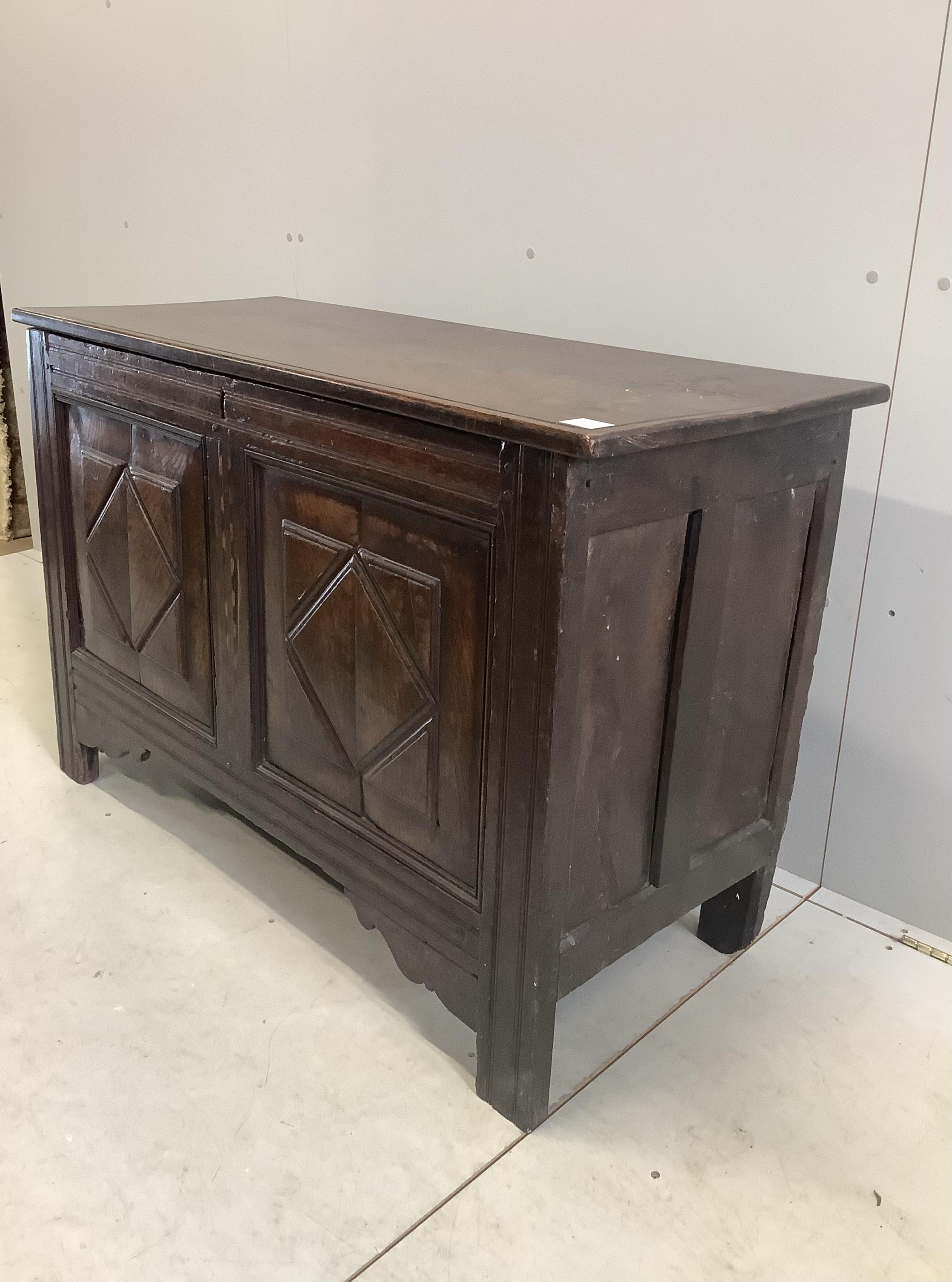 An 18th century and later parquetry inlaid oak coffer, width 124cm, depth 49cm, height 79cm. Condition - fair